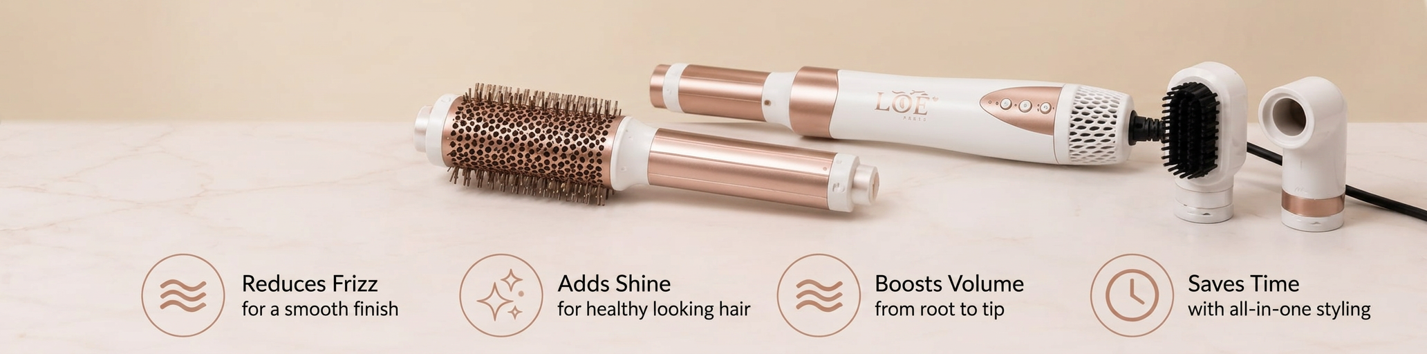 The LBY styler with its round brush, curling barrels and concentrator heads laid on marble