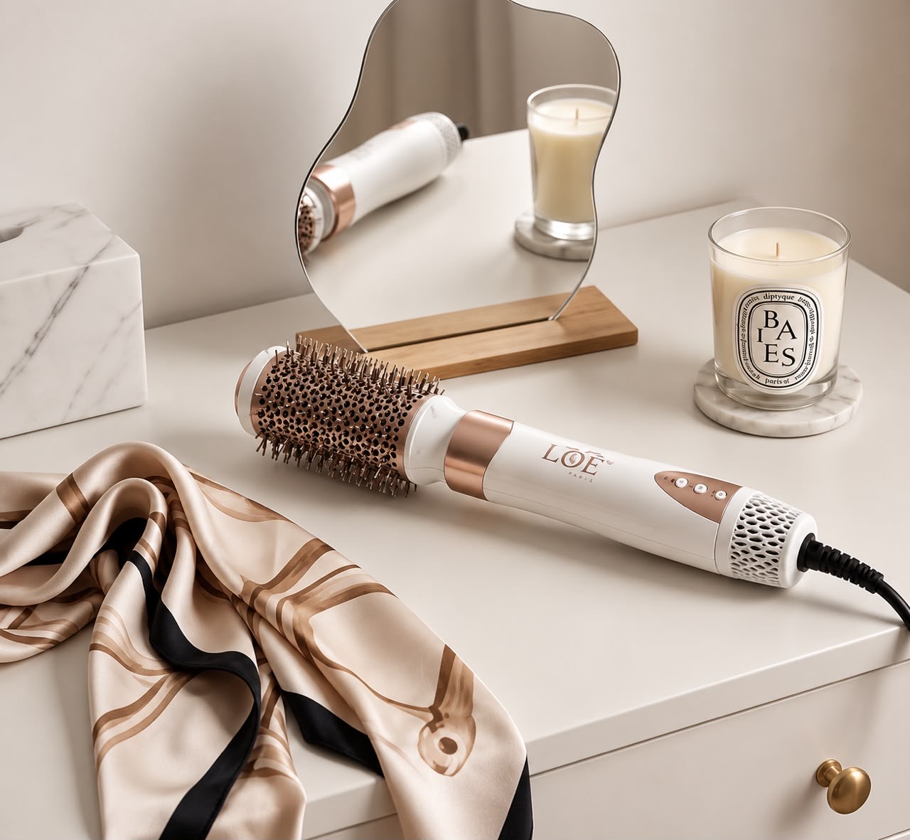 Close-up of the LBY styler handle in rose gold and pearl white